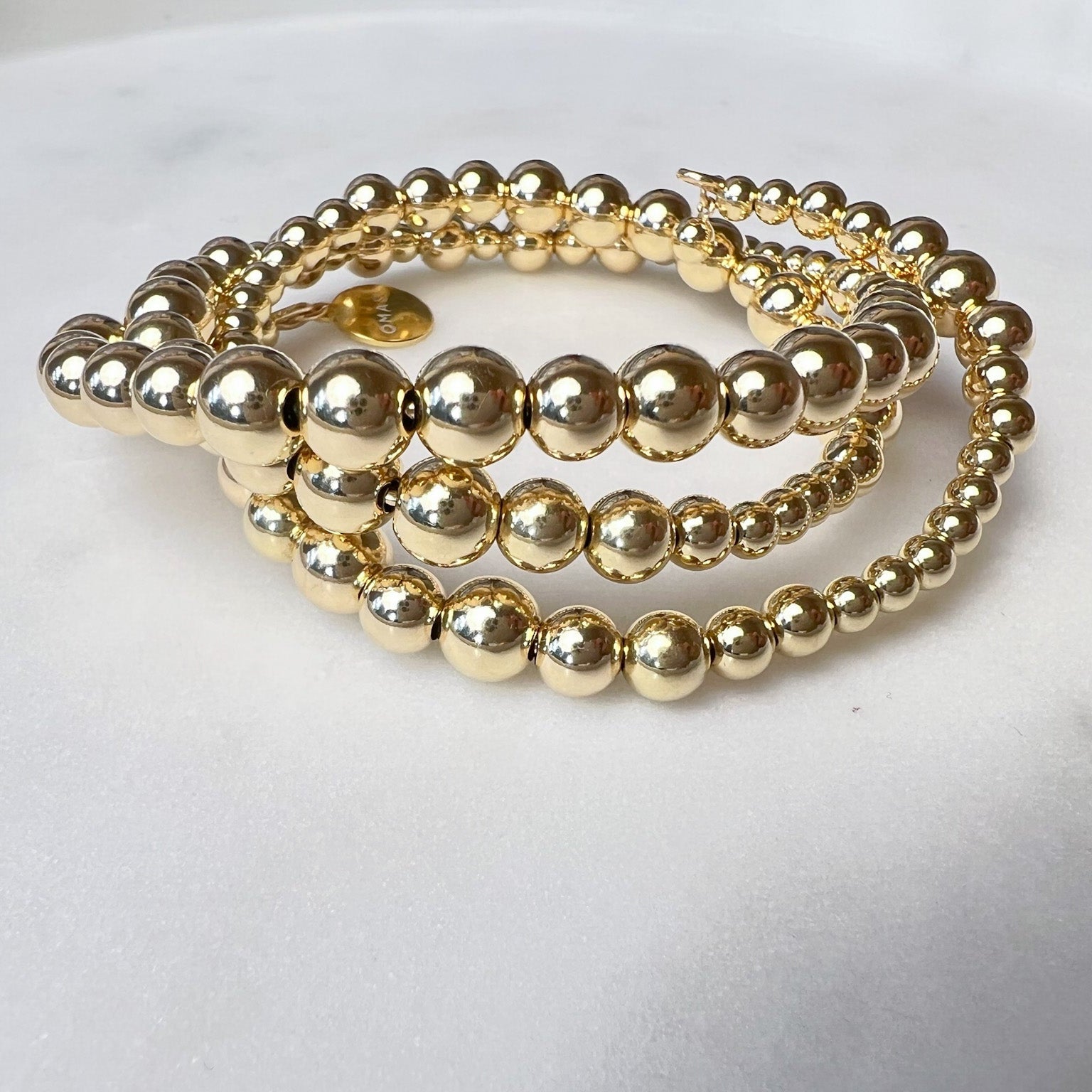 Ananke gold-filled wire bracelet flat lay – Omasi Collection Finland