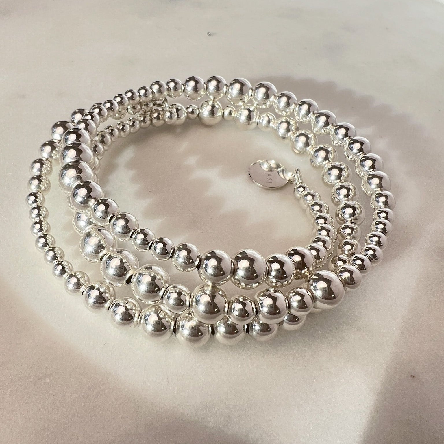 Ananke silver wire bracelet flat lay – Omasi Collection Finland