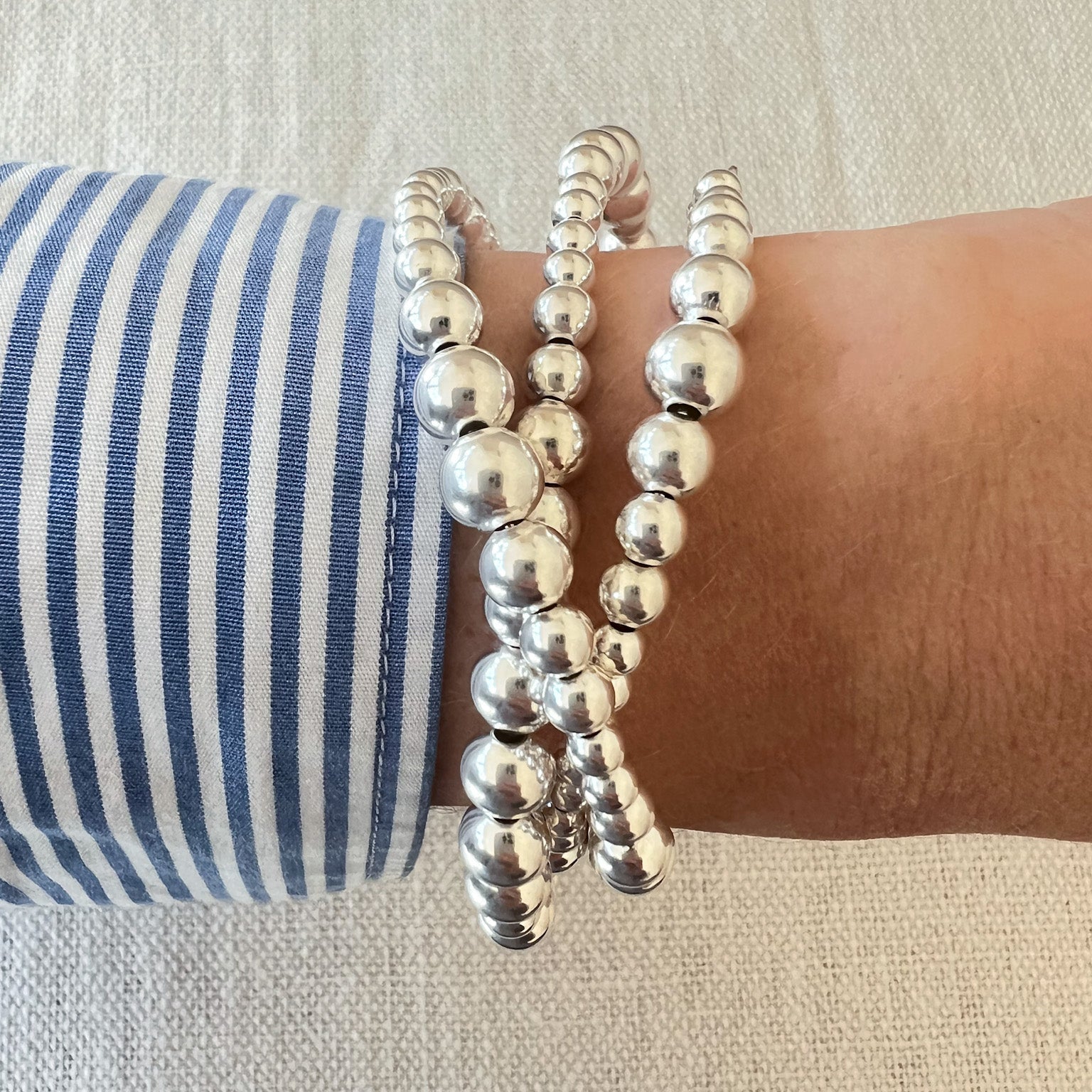 Ananke silver wire bracelet on wrist – Omasi Collection Finland