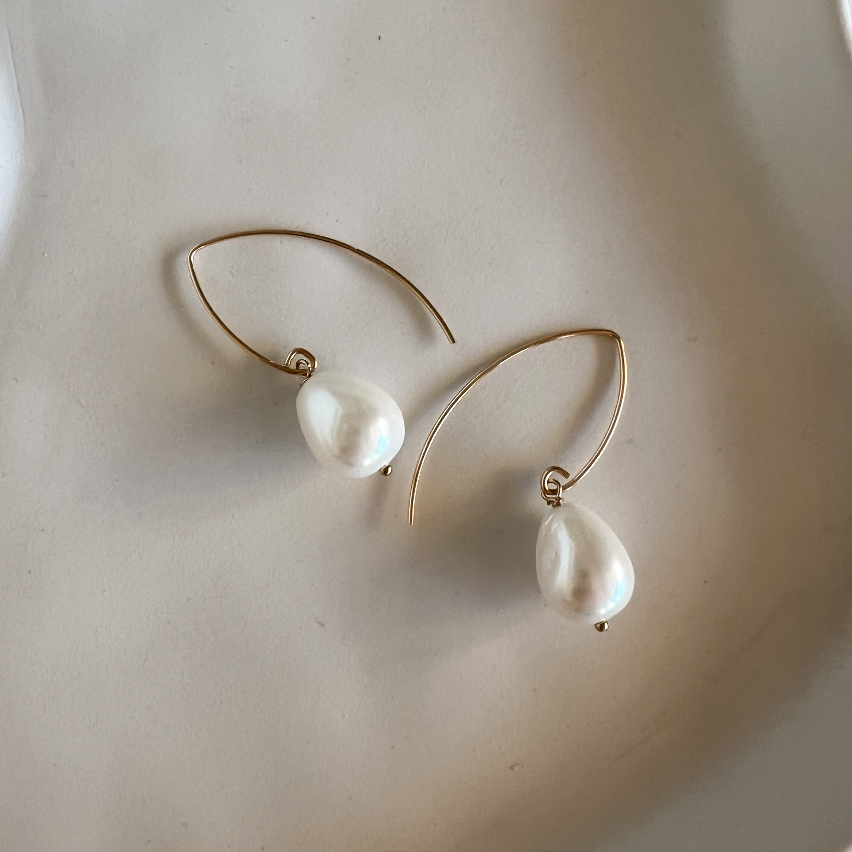 Arina gold-filled shell pearl earrings flat lay – Omasi Collection Finland