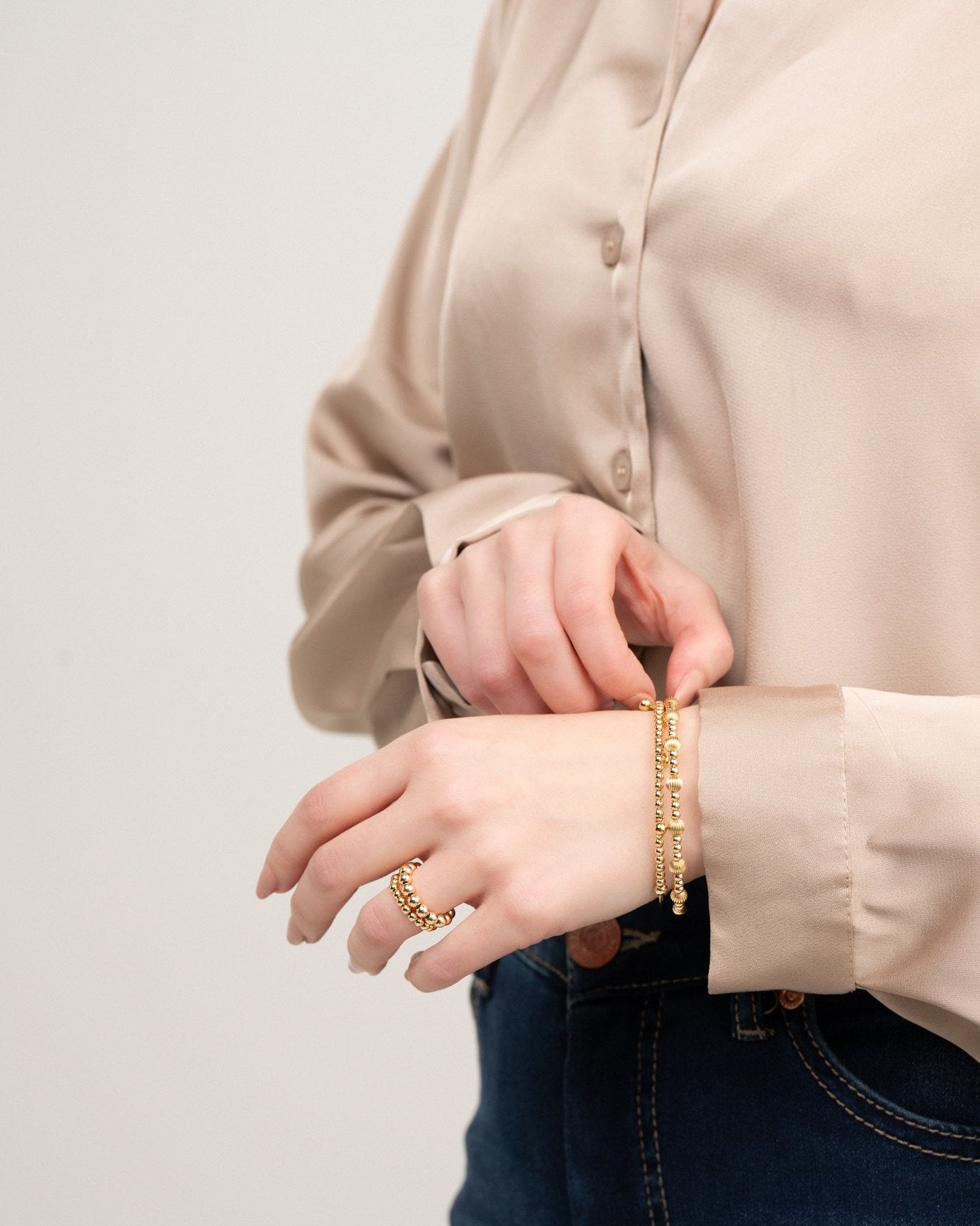 Aura II gold-filled wire bracelet worn on wrist – Omasi Collection Finland