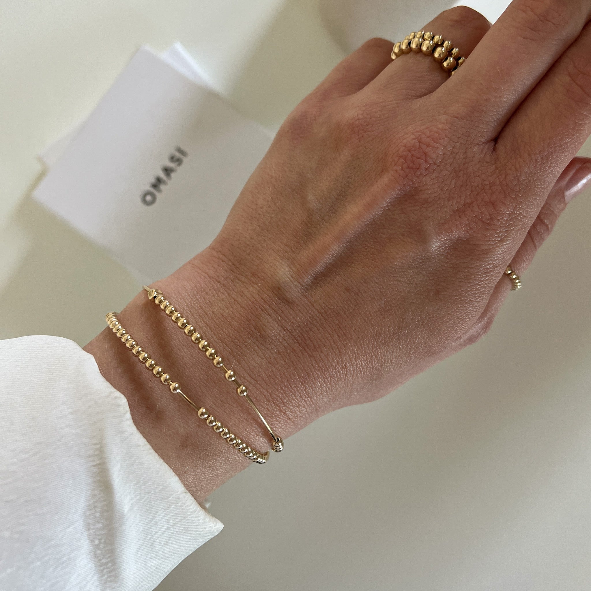 Aura gold-filled beaded bracelet on model – handmade minimalist jewellery Finland
