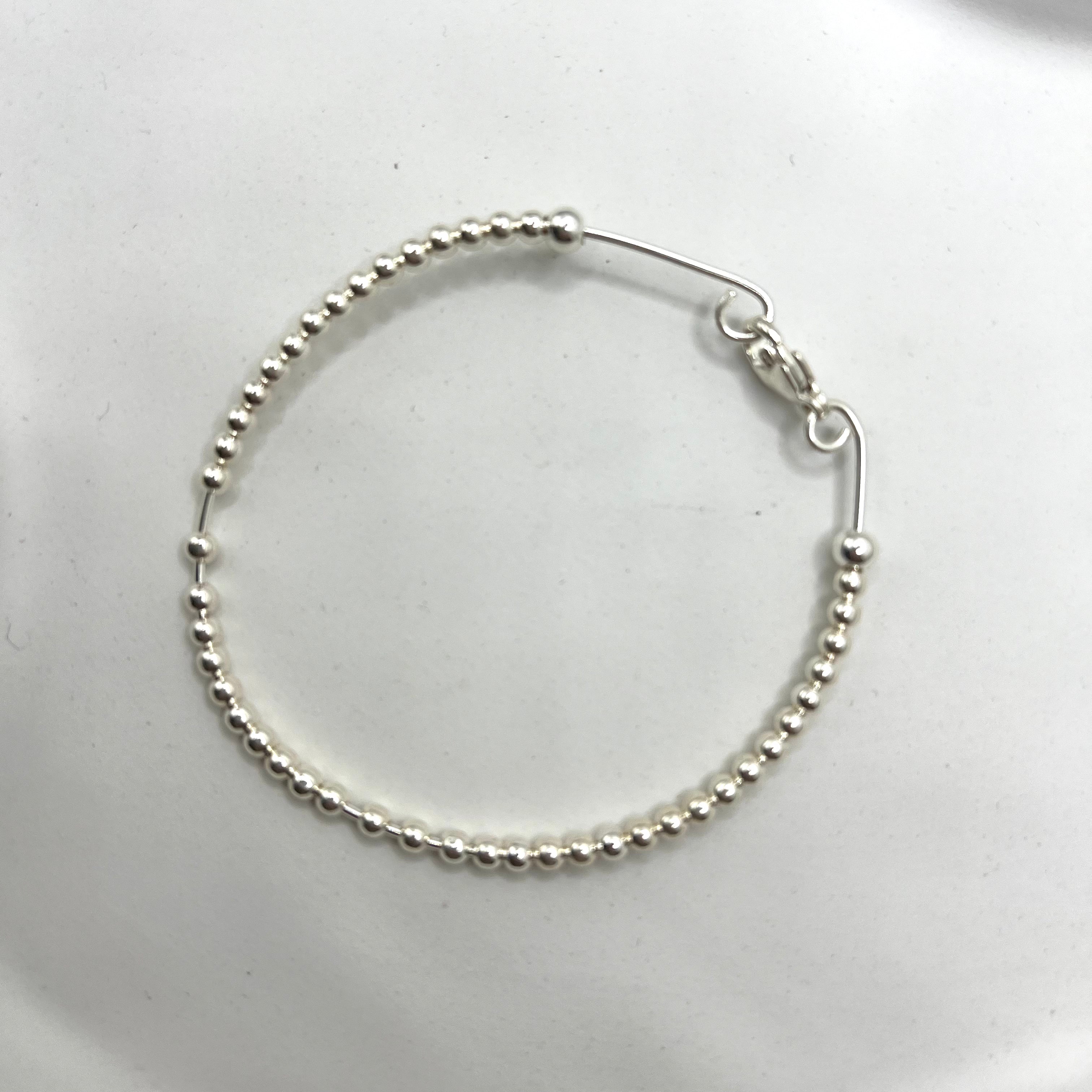 Aura sterling silver beaded wire bracelet flat lay – Omasi Collection Finland