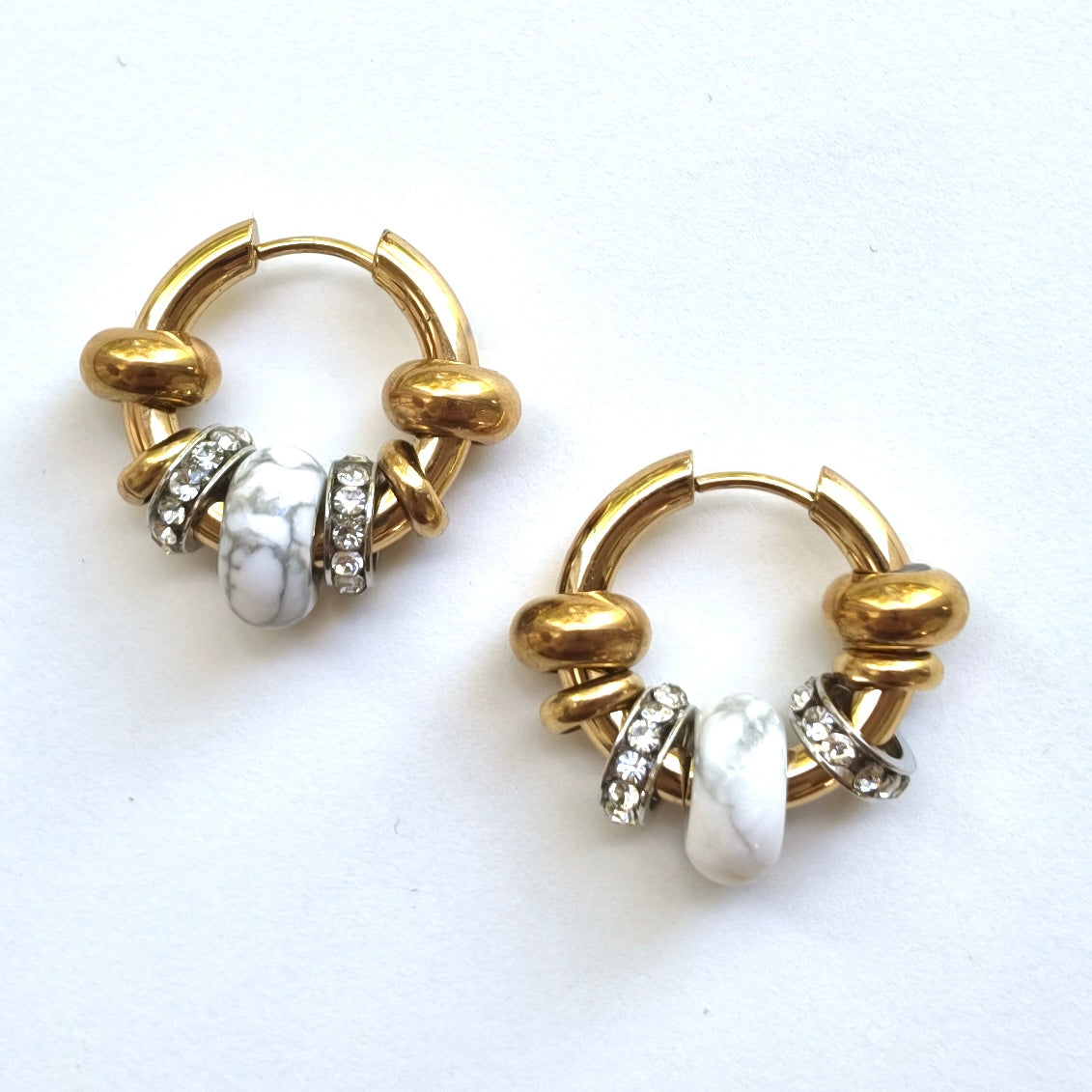 Asteria earrings by Omasi, surgical steel with a tiger eye or howlite stone