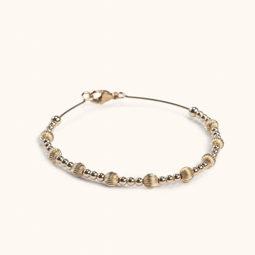 Gold-filled Aurielle wire bracelet flat lay – minimalist jewellery Finland