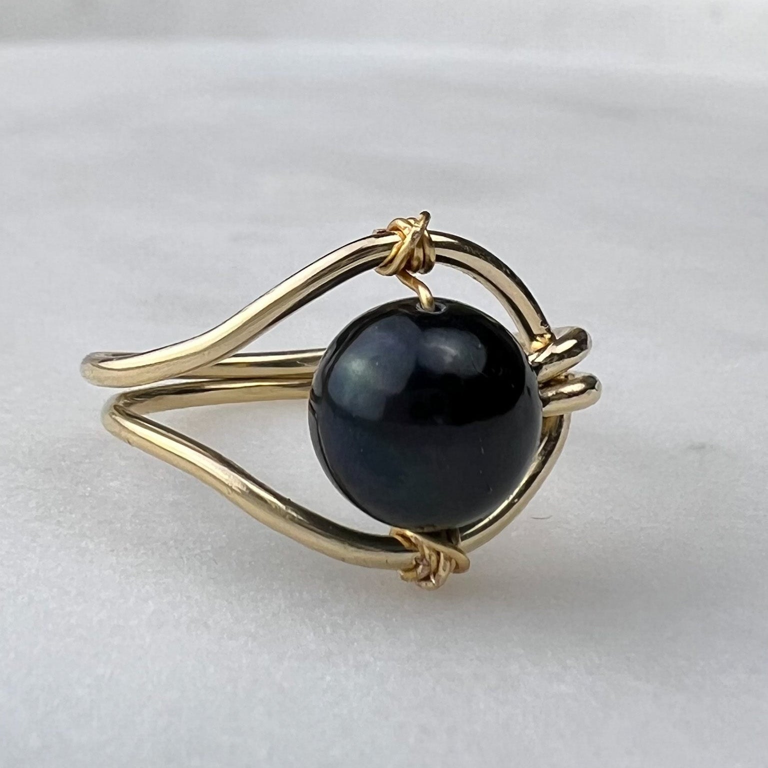 Gold-filled Luna pearl ring flat lay – handmade minimalist jewellery Finland