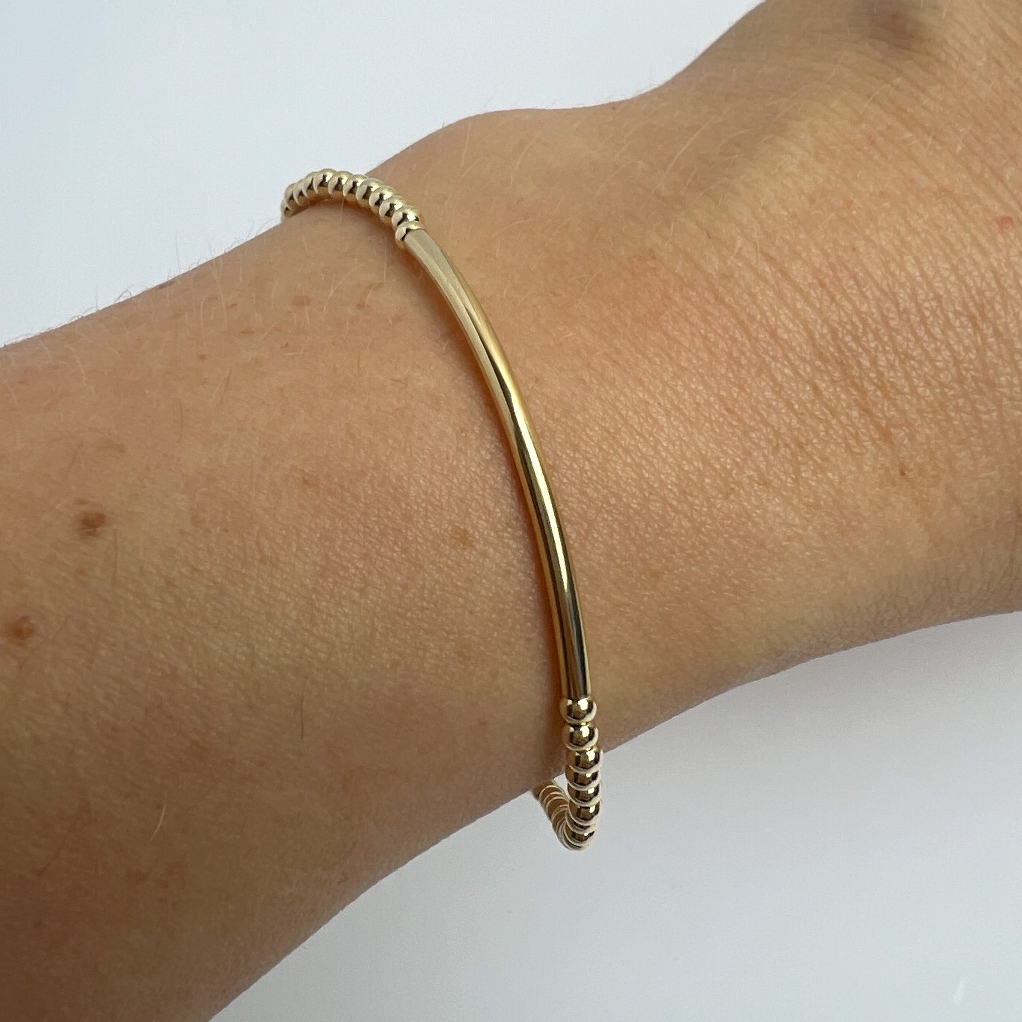 Gold-filled Nella bracelet on wrist – handmade minimalist jewellery Finland