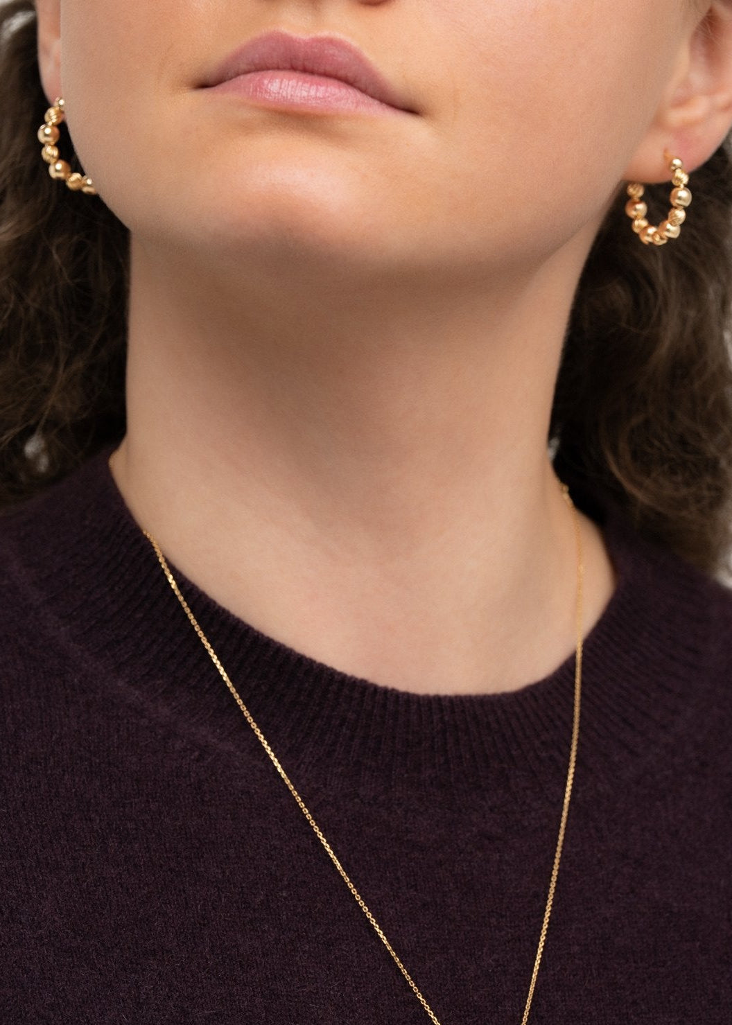 Ilona c-hoop gold-filled earrings on model – handmade minimalist jewellery Finland