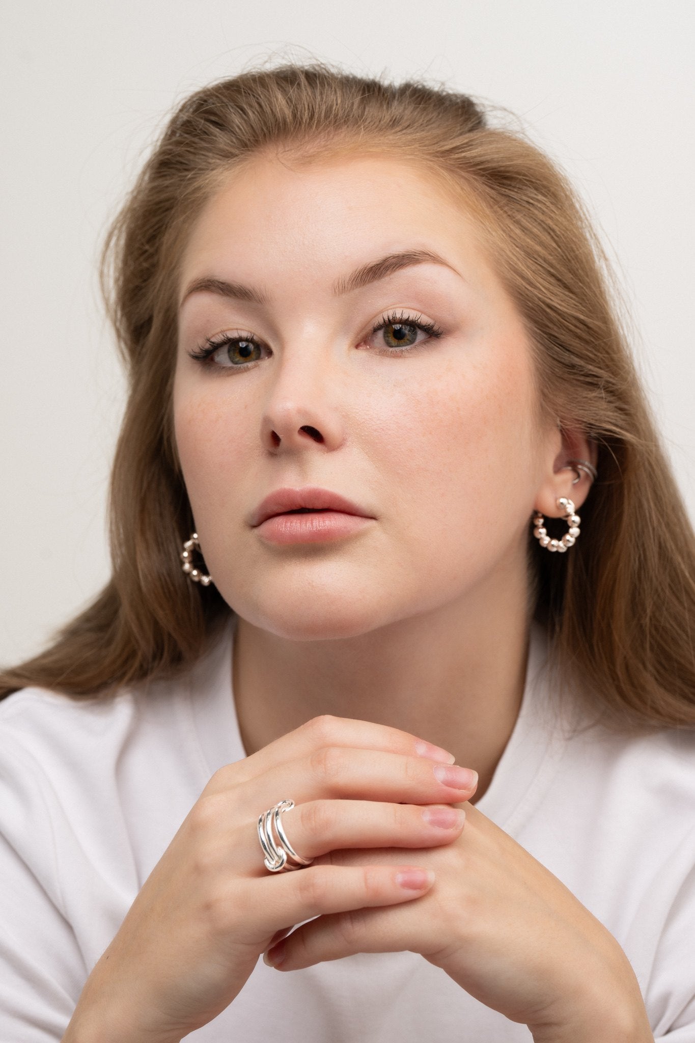 Ilona c-hoop silver earrings on model – handmade minimalist jewellery Finland