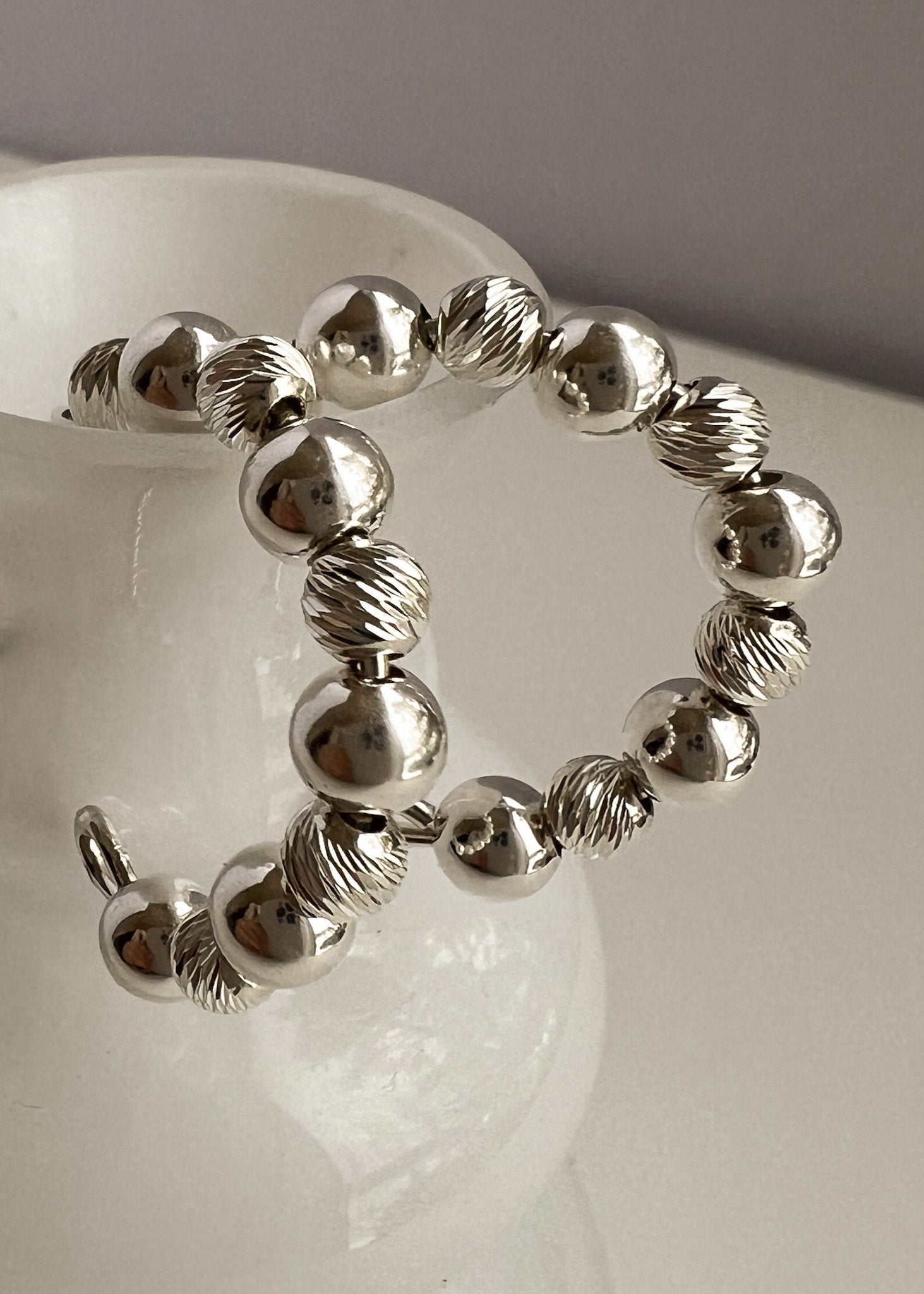 Ilona sterling silver c-hoop earrings close-up – handmade jewellery Finland