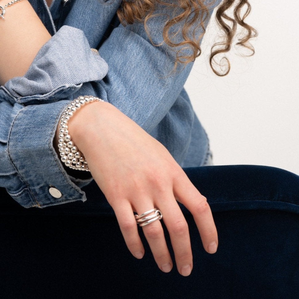 Isola recycled silver three-band ring on hand – Omasi Collection