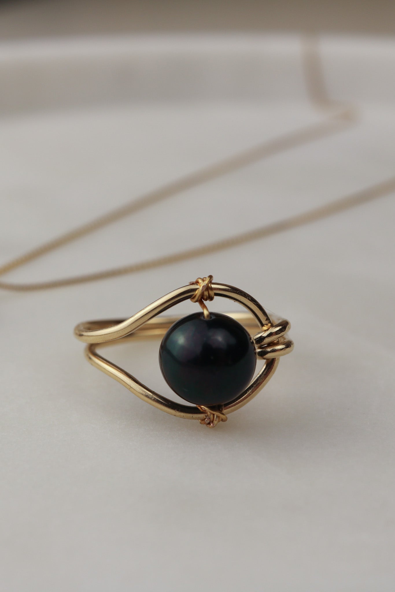 Luna Noir black pearl ring flat lay – handmade ring Finland