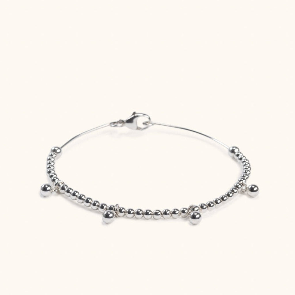 Melia silver wire bracelet with drop balls flat lay – Omasi Collection Finland