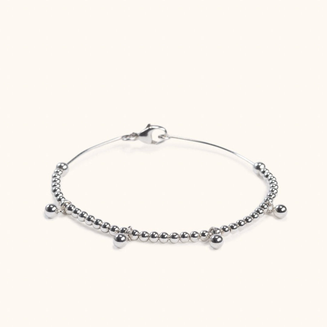 Melia silver wire bracelet with drop balls flat lay – Omasi Collection Finland