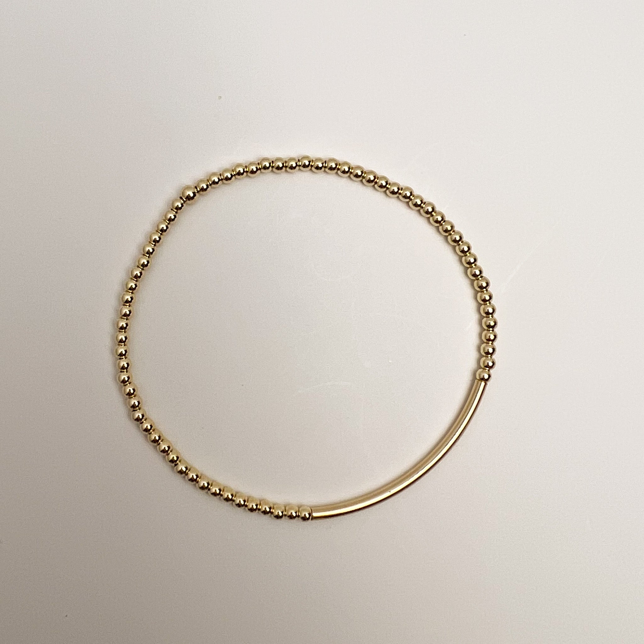 Nella bracelet flat lay – gold-filled Omasi Collection