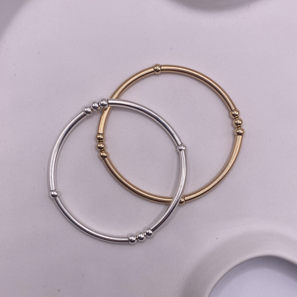 Selene silver and gold-filled bracelets together flat lay – Omasi Collection