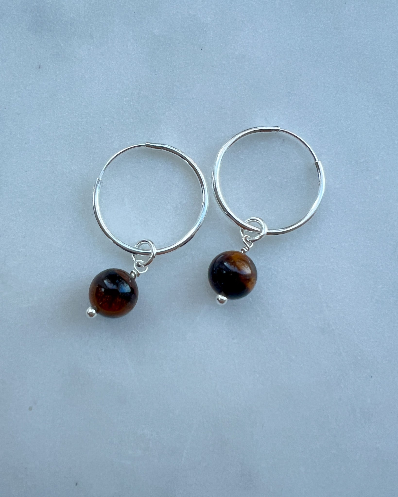 Sterling Silver Tiger eye Freya Hoop Earring flat lay – handmade minimalist jewellery Finland 
