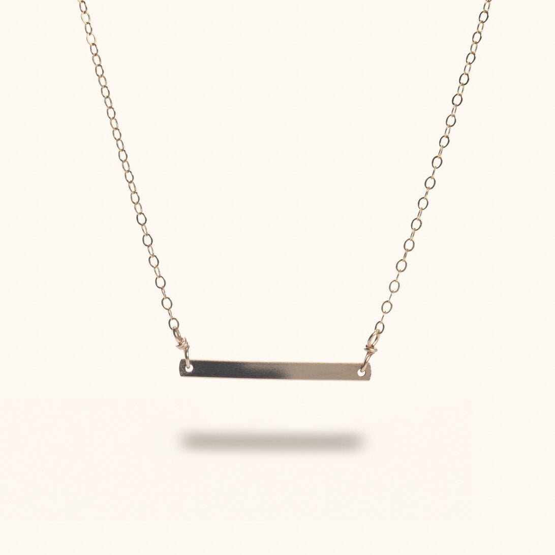 Sylva gold-filled bar necklace flat lay – Omasi Collection Finland