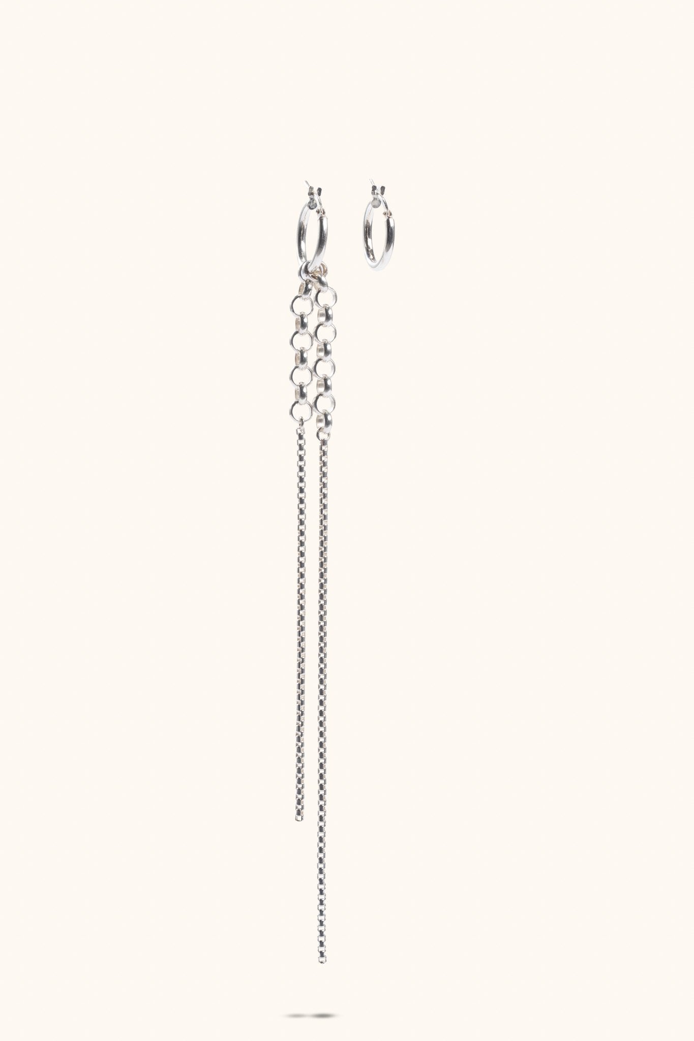 Vela sterling silver hoop and chain earrings flat lay – Omasi Collection