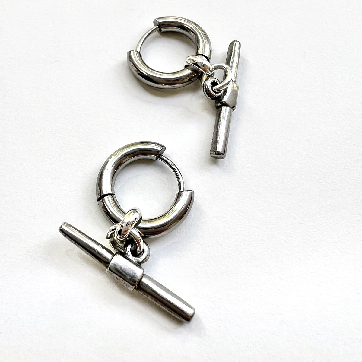 Mova silver tone T-bar hoop earrings, close-up of the 15mm hoop and 23mm bar – Omasi Collection
