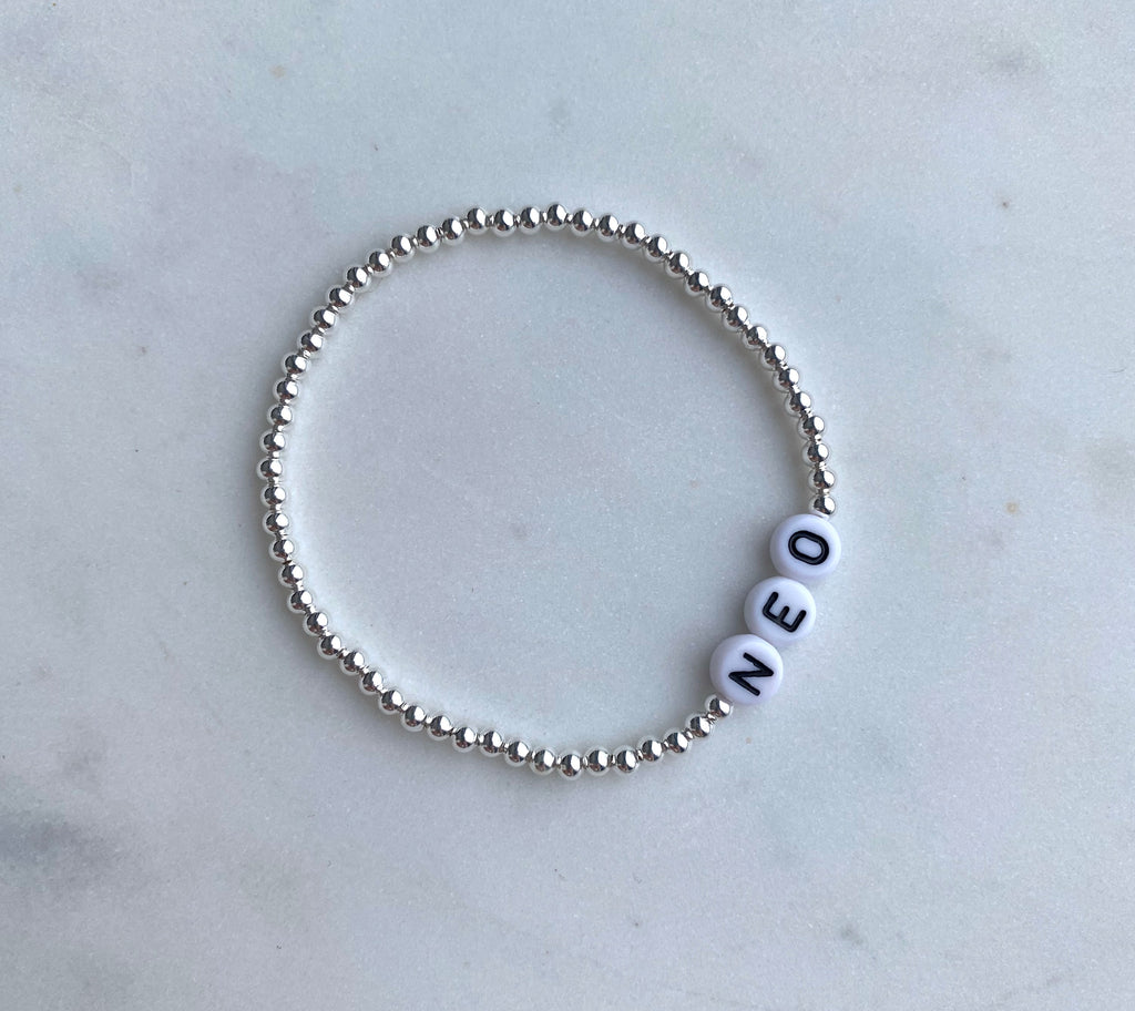 Eila silver bracelet with white letter beads – Omasi Collection Finland